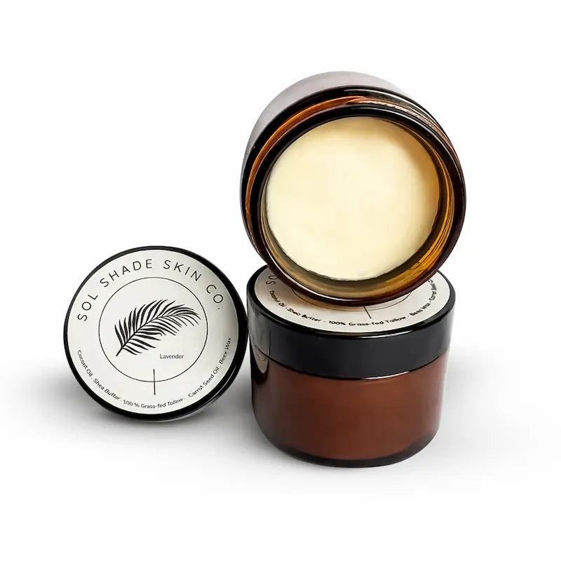 Brown jar with cream and lid featuring 'Sol Shade Skin Co' on a white background