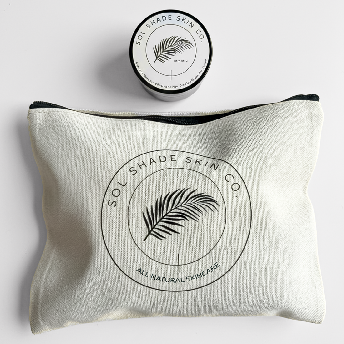 White pouch with Sol Shade Skin Co. logo and a small container on a light gray background